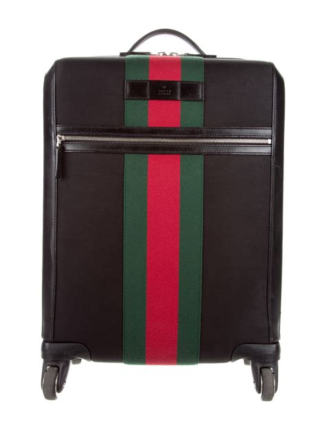 gucci carry on suitcase.